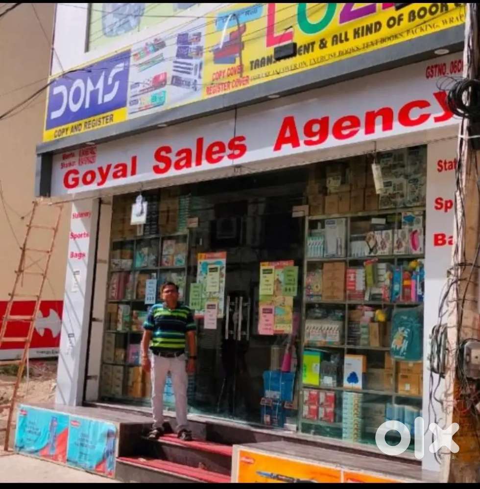 Driver + helper at stationary shop