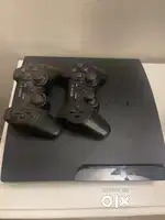 PS3 with controllers and games