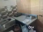 Hotel equipments, like three burner range, shink, working table