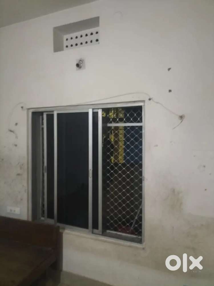 Single room with attached bathroom and kitchen.