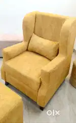 Accent chair with foot stool and backrest cushion