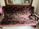 A 5-seater sofa, divan cot, and dining table
