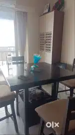 4 seater Dining table with 2 revolving chairs