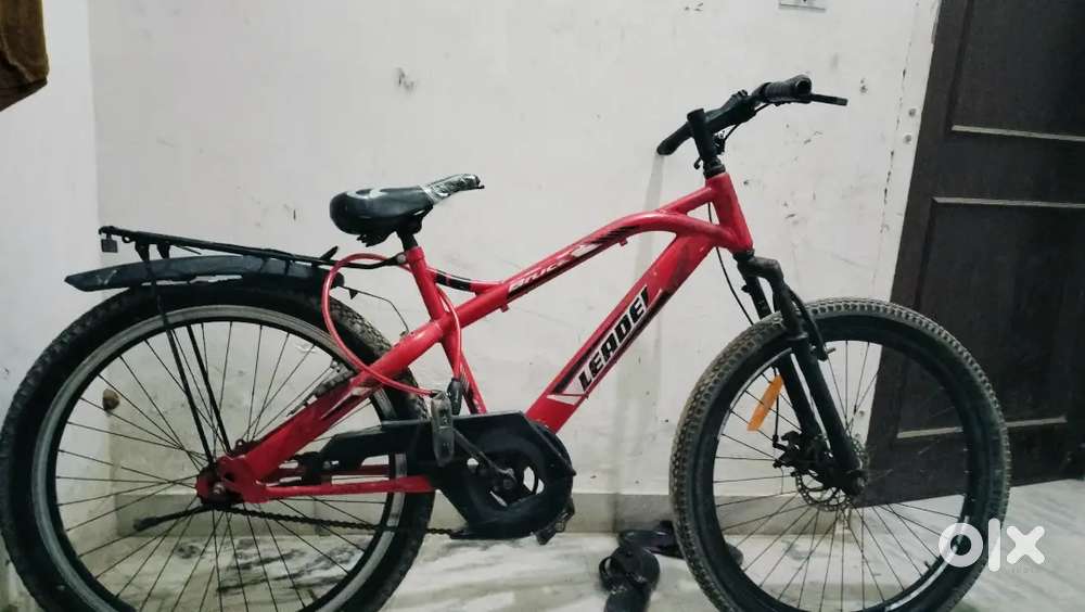 It is a red and black colour bycycle