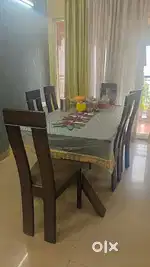 Dining table. Glass top with 6 chairs