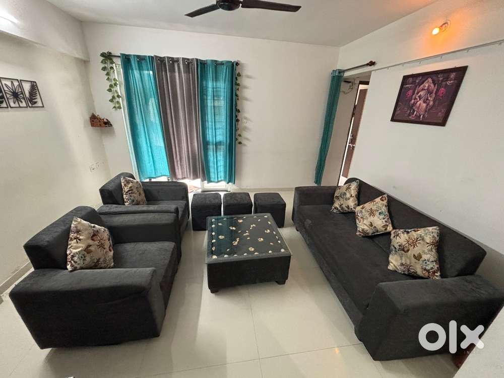3+2 seater sofa with 3 puffies, center table