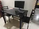 Glass dining table with 4 chairs.