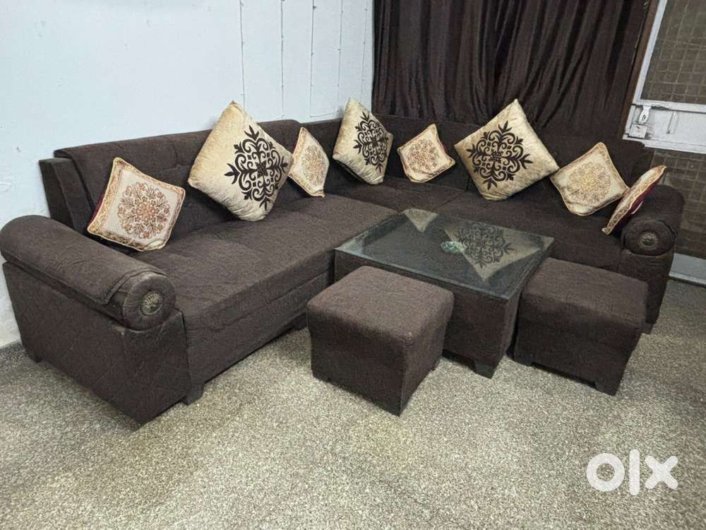 L shape 7 seater sofa set with 1 Central Table & 2 puffy.