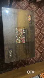 Wooden center table with glass