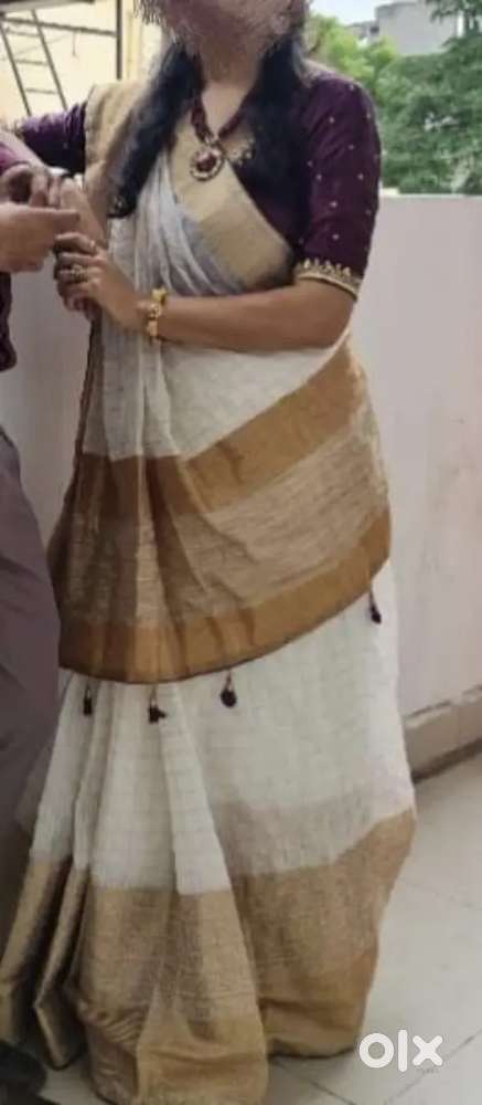 White Heavy Saree with work Blouse.