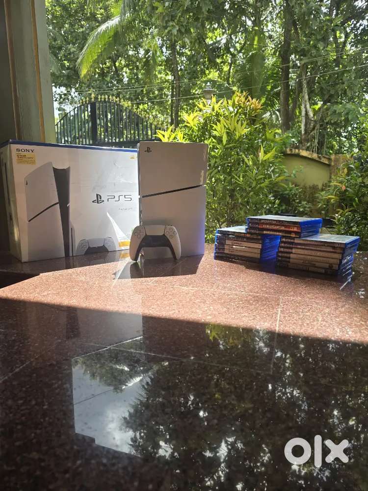PlayStation 5 Slim Disk Edition with 15 game discs.