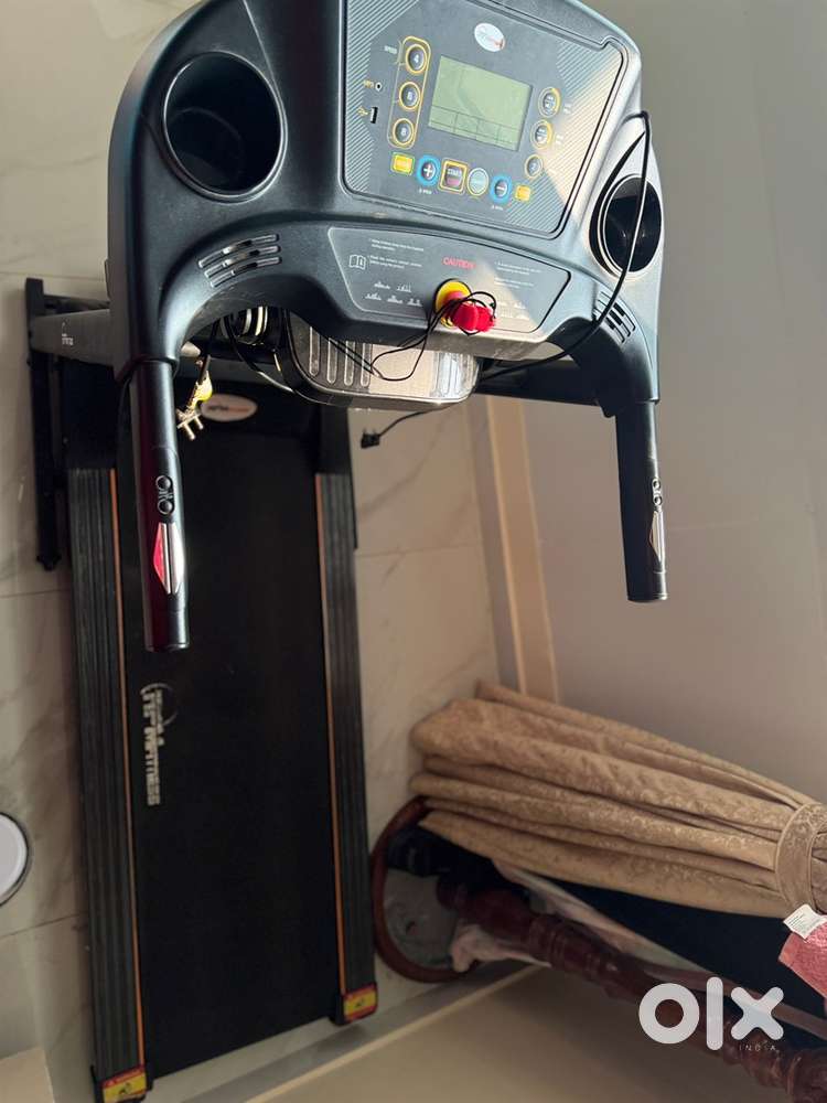 Treadmill with massager belt