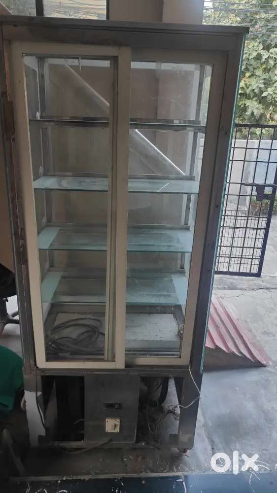 Fruits and cakes display fridge