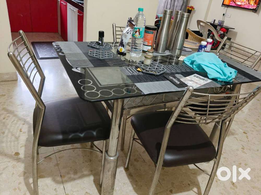 Glass & Steel Dining Table and Aquag purifier 3 years well maintained.