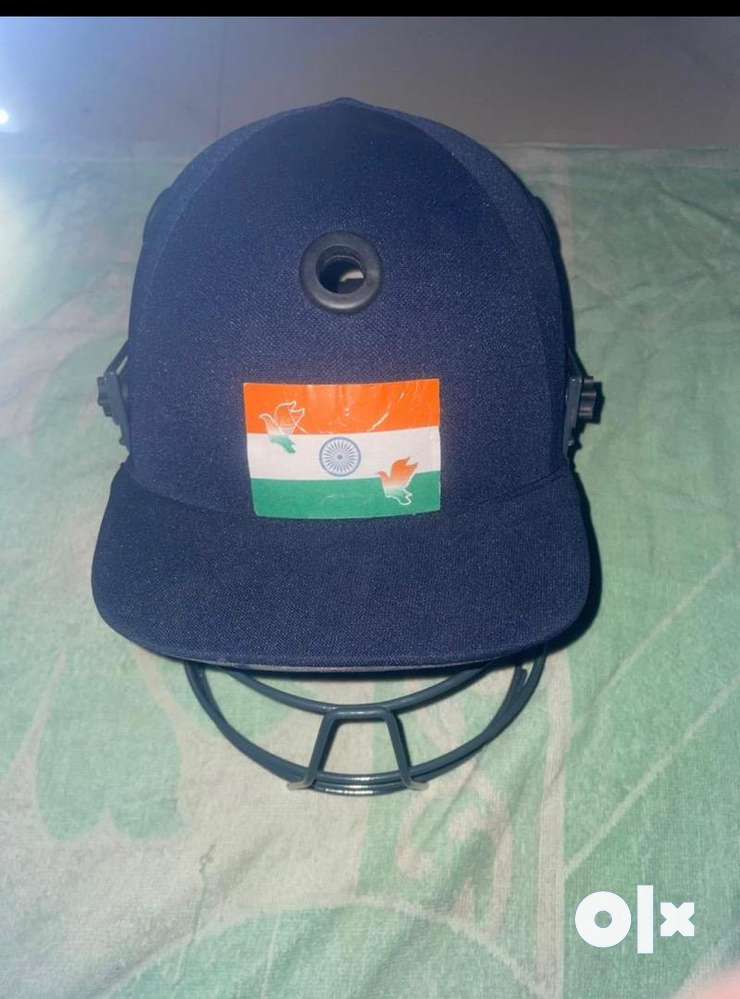 Cricket helmet and thigh pad