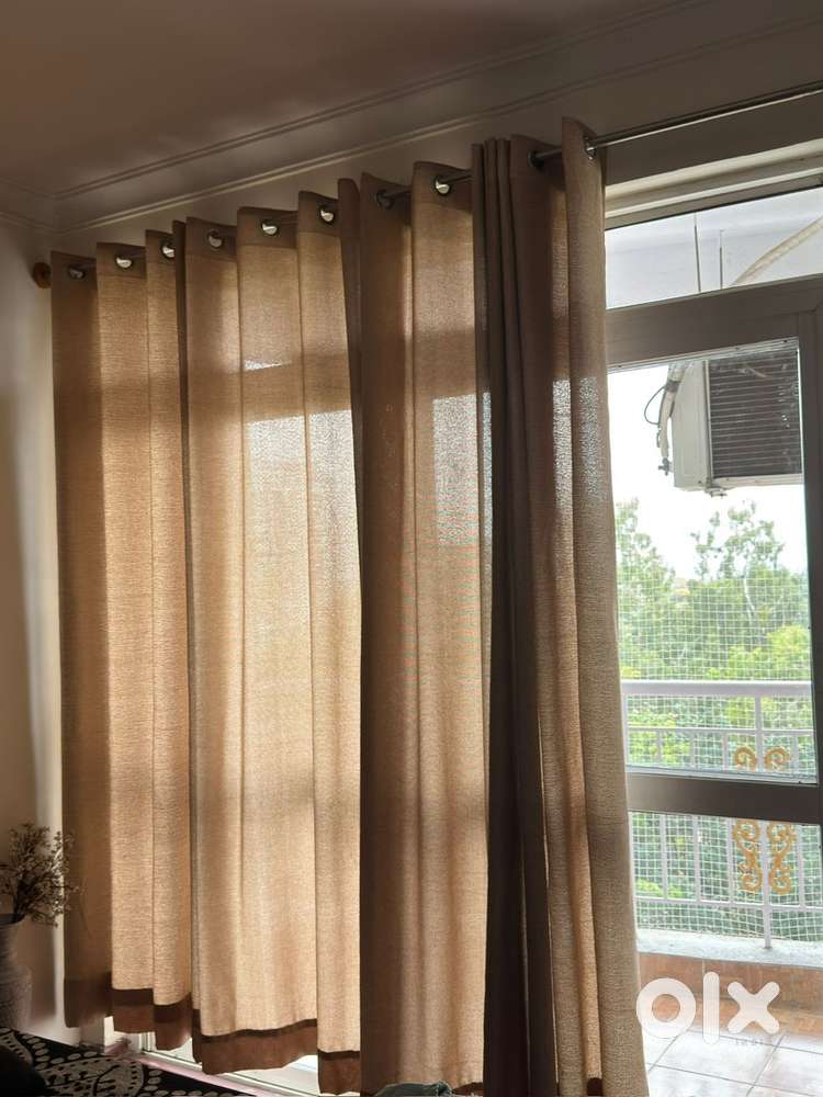Four heavy linen-flex long door curtains.