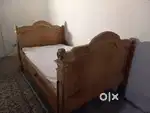 One wooden Bed and study table for sale.