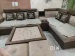 L.shape sofa set with centre table and two puffs