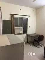 Room with attached bathroom and kitchen
