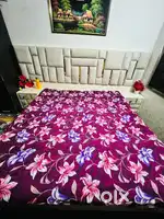Double bed with floral pattern