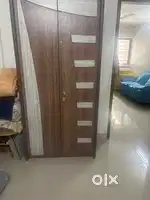 Wooden wardrobe and small bed with mattress