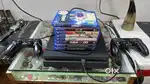 Playstation 4 with 2 controllers and 8 games