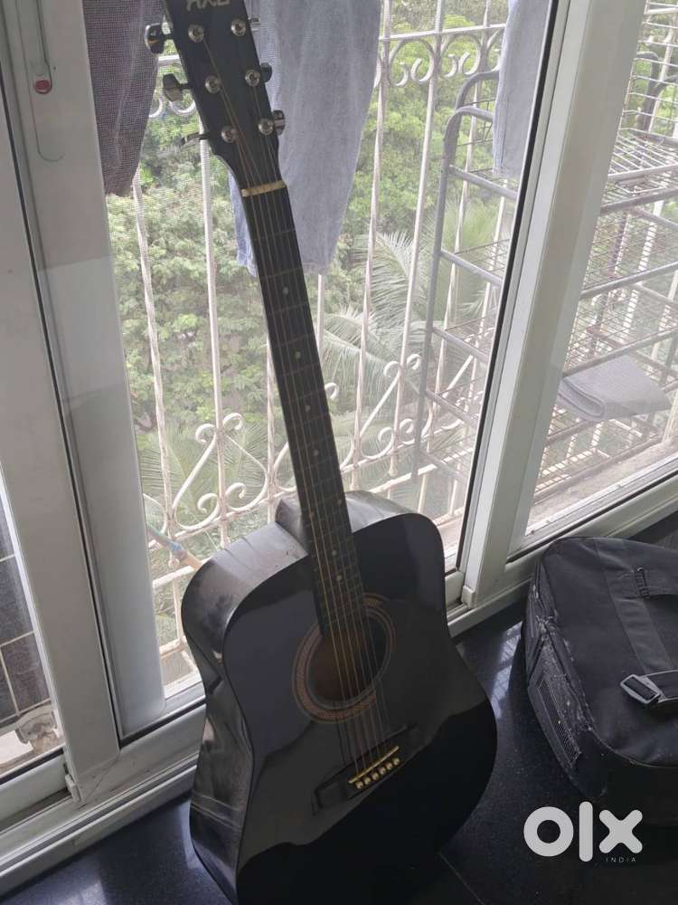Acoustic Guitar with Bag and 1 pick - Gently Used