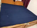 Double cots with mattresses.