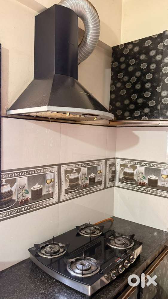 Preethi 4 burner stove with Faber chimney