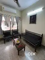 5 seater Sofa and a glass top center table