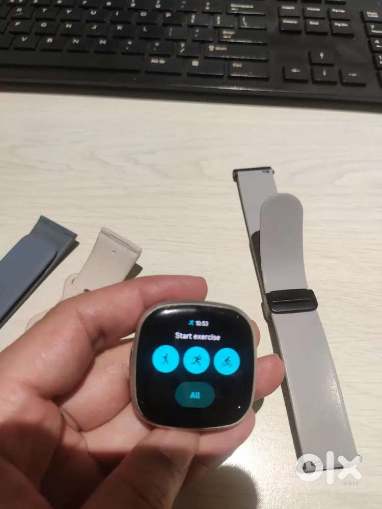 Fitbit Versa 4 smartwatch with accessories