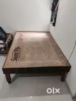 A wooden bed 4.25x6.5