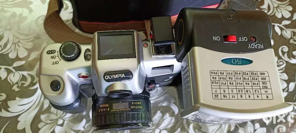 Old Olympia reel camera with flash gun