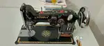 Sewing machine with electric motor table