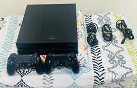 Playstation 4 with 2 DualShock 4 controllers
