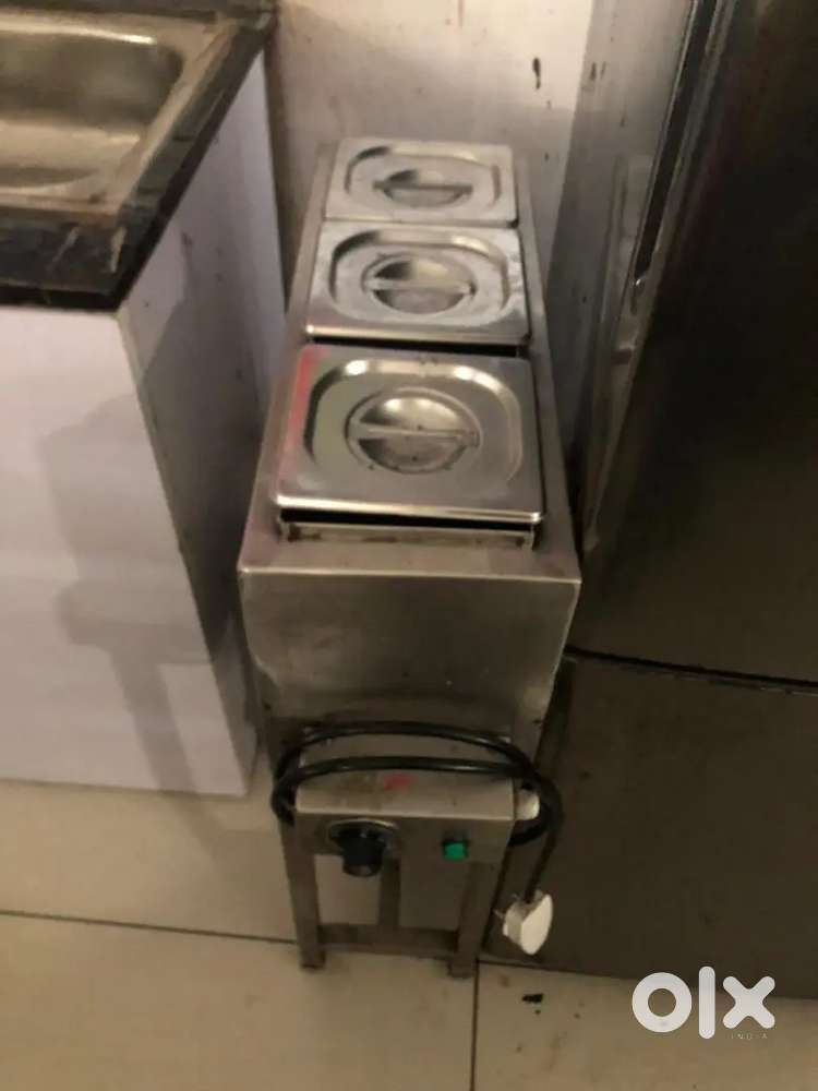 Chocolate melting machine with stand.