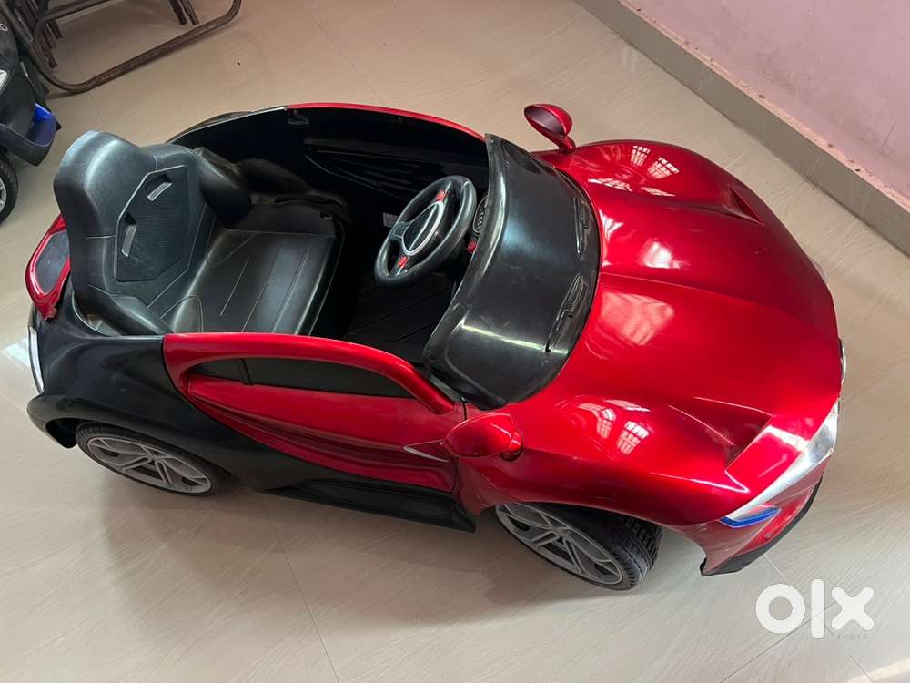 Red color car. battery operated.