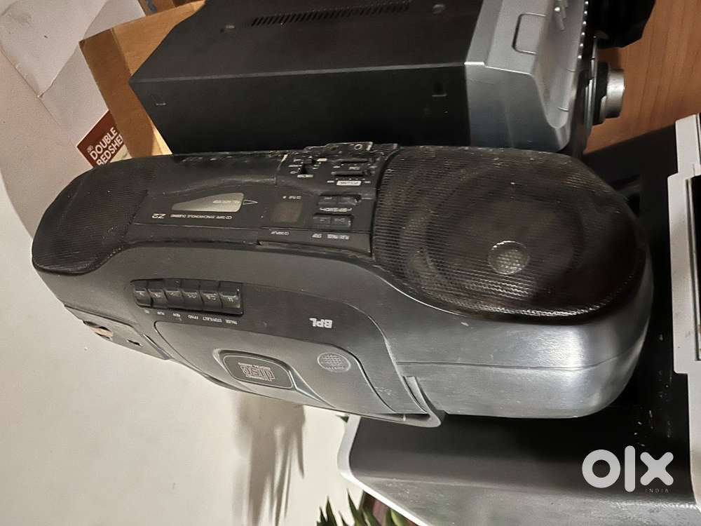 Small refrigerator along with printer, music system and table fan