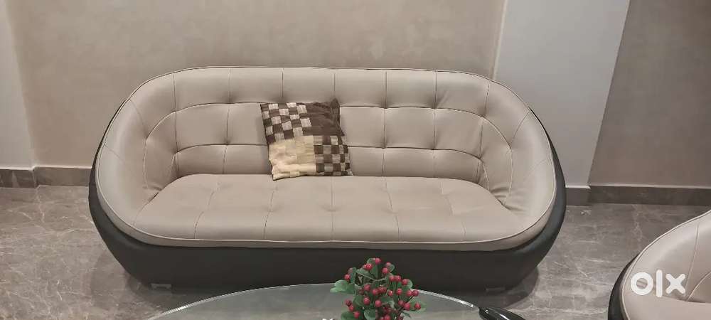 Godrej 5 seater sofa and table