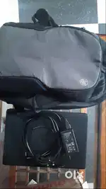 HP Laptop along with a laptop bag and the charger.