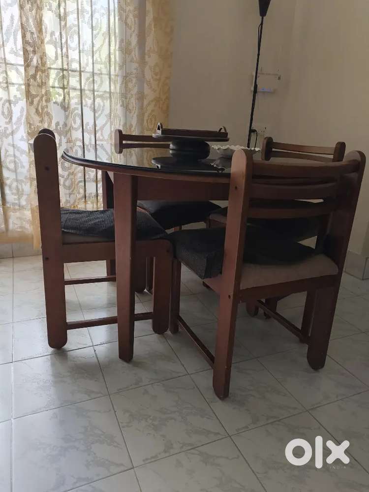 Round dining table with glass top