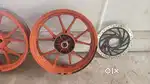 Genuine Duke 250 orange alloy wheel for sale