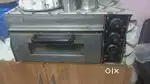 Commercial kitchen appliances like griller , oven, stove and TV