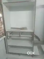 Double door wardrobe with single cabinet in between