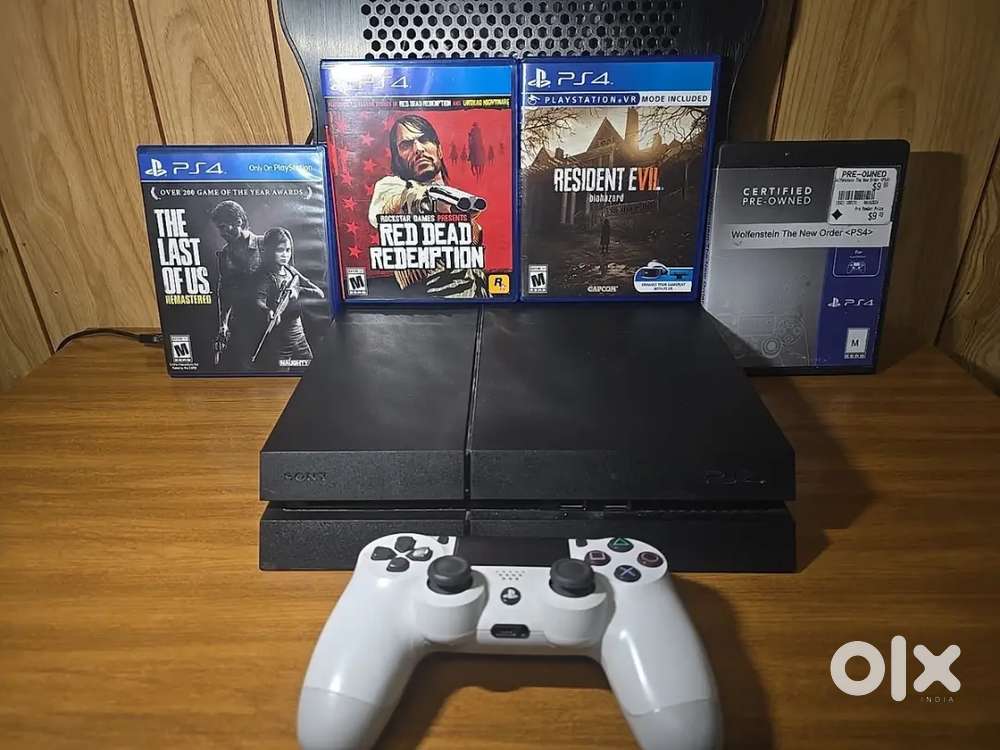 Playstation 4 Bundle With Four Games, A Controller, And A Console Fan