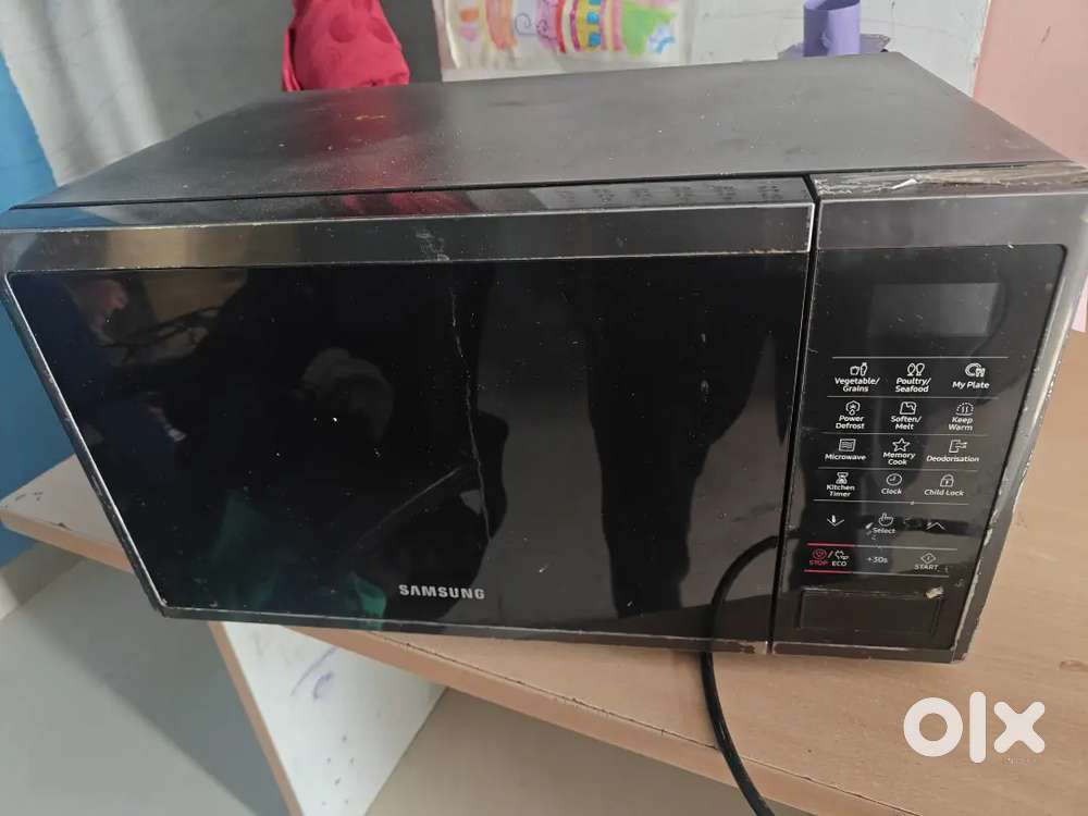 Microwave oven less used , full working