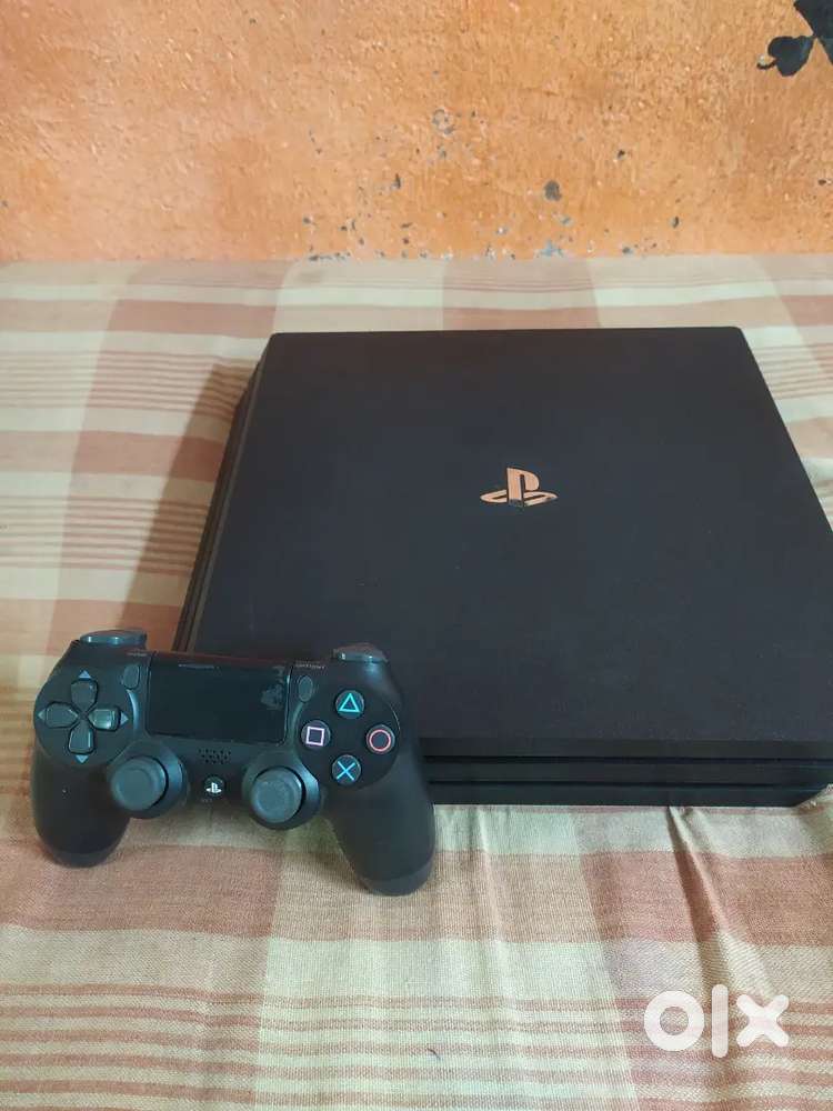 PS4 Pro 1TB + 2 Controllers – Excellent Condition