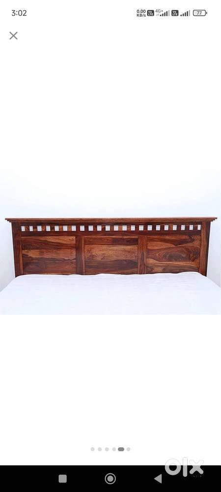 Wooden bed including storage