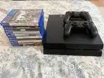 PS4 with 2 controllers and 10 games