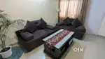 Selling my designer sofa just 6 month old with glass centre table